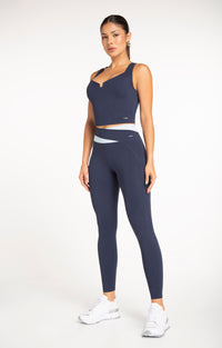 Motion Wrap Legging in True Navy with matching sports bra - women's navy activewear set, full length view